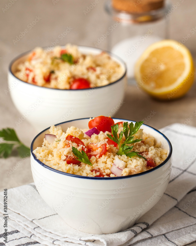 Tabouleh is an Arabic vegetarian salad made with couscous, tomatoes, parsley. Healthy lunch Tabouleh is an Arabic vegetarian salad made with couscous, tomatoes, parsley. Healthy lunch