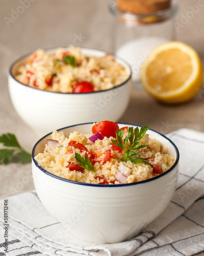 Tabouleh is an Arabic vegetarian salad made with couscous, tomatoes, parsley. Healthy lunch