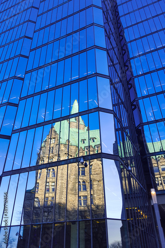 Reflections of buildings with mirrored windows new and old Ottawa