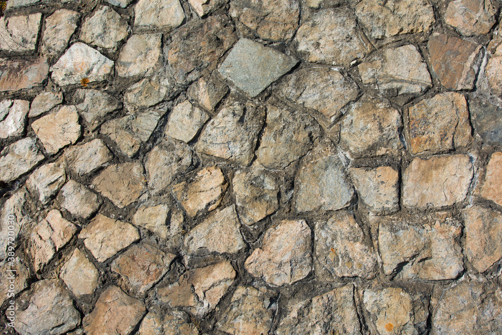 Fototapeta premium Light yellow masonry made of natural stone.