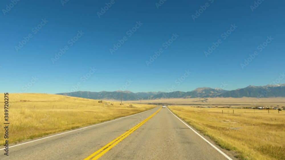 Driving plains of Montana mountain valley POV 4K. Along the Madison River in rural Montana near Yellowstone National Park. Originally a gold mining town. Tourism and outdoor recreation destination. Driving plains of Montana mountain valley POV 4K. Along the Madison River in rural Montana near Yellowstone National Park. Originally a gold mining town. Tourism and outdoor recreation destination.