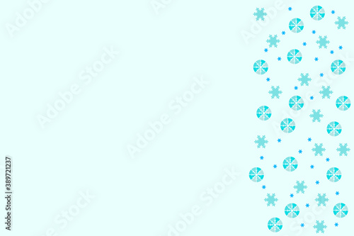 Blue snowflakes on a light blue background. A frame made of repeating elements. Drawn winter background