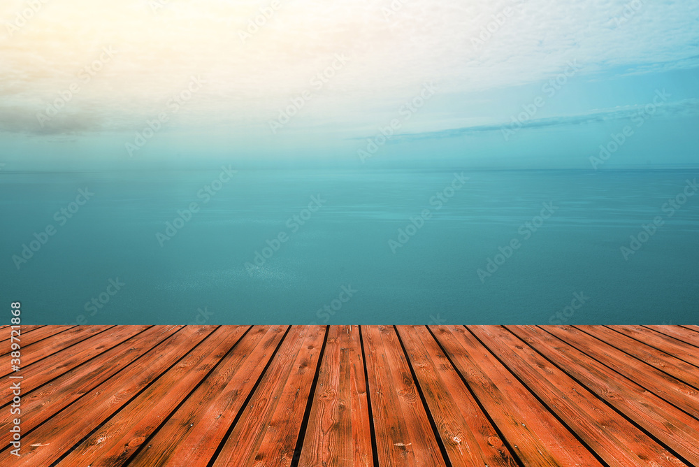 Wooden table top and sea or ocean views with turquoise skies. Display concept of festive background or advertising products. Empty wood table top. Summer seascape