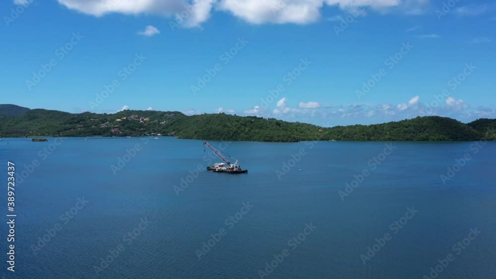 Dredging machine in Martinique Fort de France bay aerial view sunny day
Dredging machine in Martinique Fort de France bay aerial view sunny day