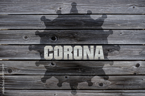Corona auf Holzhintergrund © mazolafoto