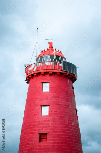 Photography Red and white lighthouse in Dublin Ireland
