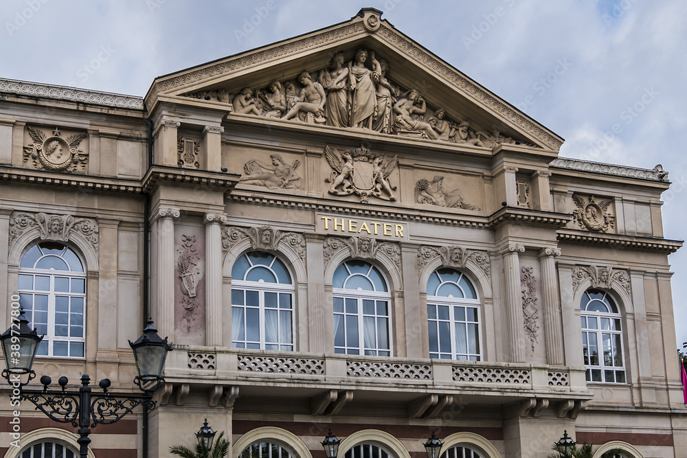 Obraz premium View of Baden-Baden Theater (1862) building. Baden-Baden Theater - neo-baroque white-and-red sandstone building. Baden-Baden, Germany.