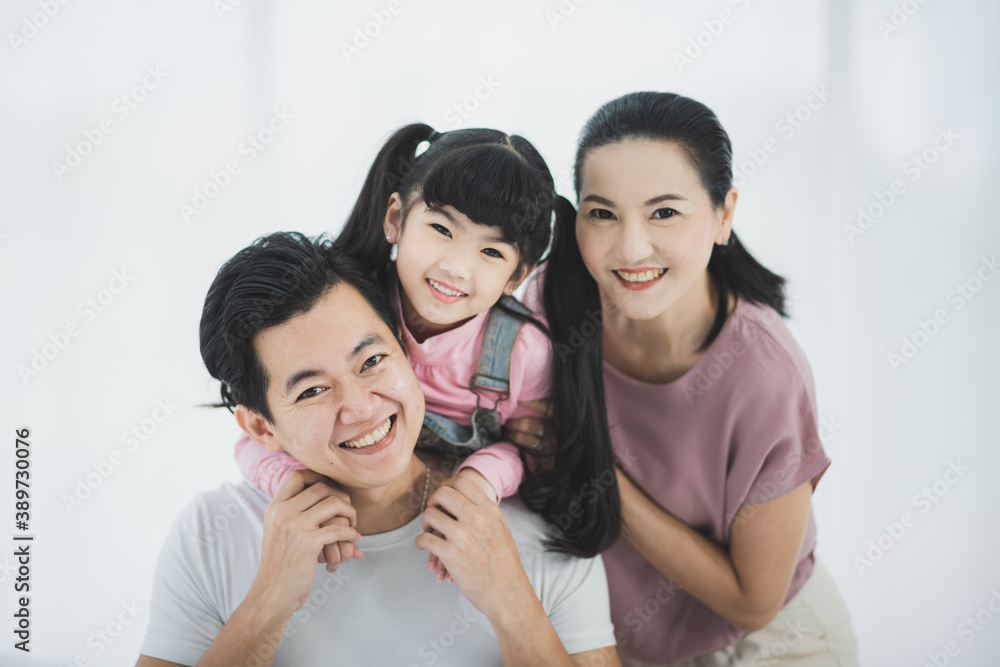Happy asian family father mother with daughter looking camera with smile face. Happy asian family father mother with daughter looking camera with smile face.