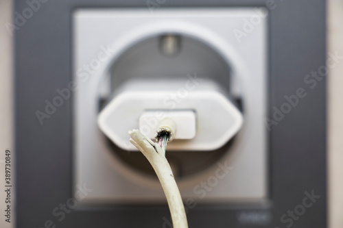 Wallpaper Mural close up photo of damaged charging cable. technological concept image Torontodigital.ca