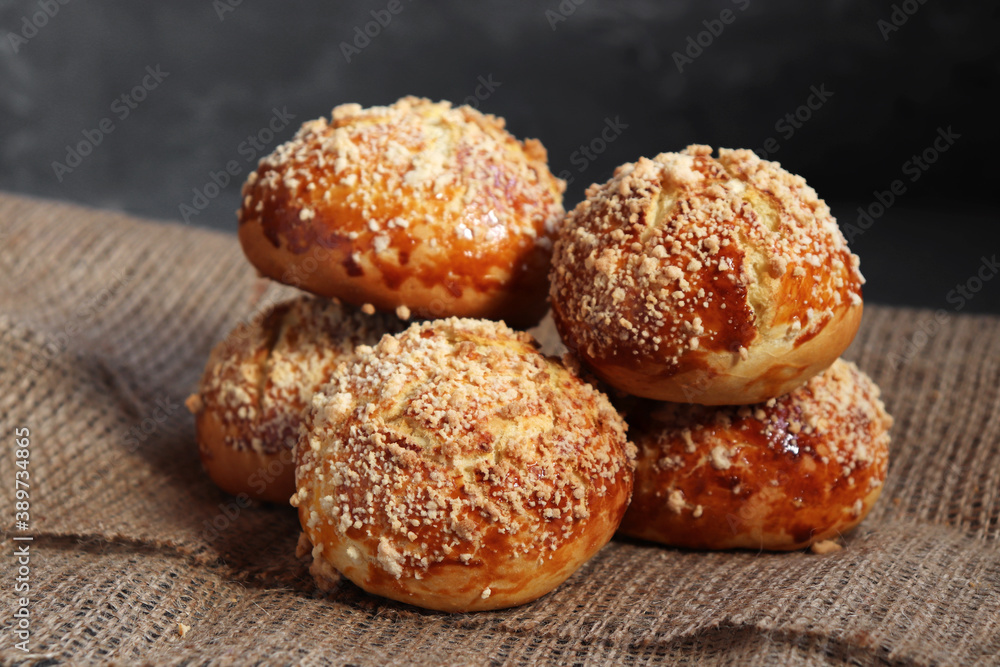 Bread rolls on dark rustic background, on burlap. Bread rolls on dark rustic background, on burlap.