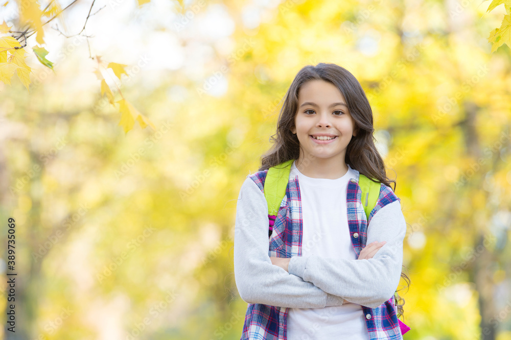 perfect autumn day of smiling child with school bag in fall season park in good weather, school time perfect autumn day of smiling child with school bag in fall season park in good weather, school time