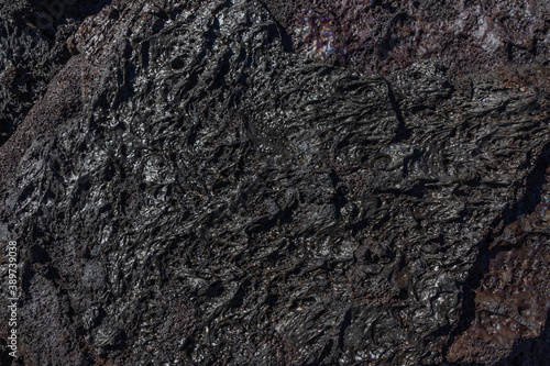 Basalt lava rock surface texture from a flow at Hawaii Volcanoes National Park, Big Island of Hawaii, USA