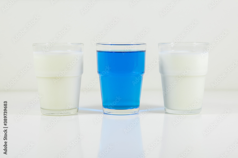 Glasses of lemonade in colors representing flag of Finland. It is a photo in a series of similar photos perfect to use in a quiz. Glasses of lemonade in colors representing flag of Finland. It is a photo in a series of similar photos perfect to use in a quiz.