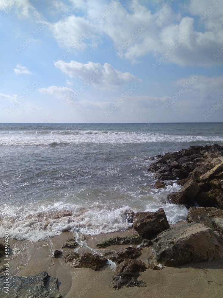 Beautiful view of the stones and the Mediterranean Sea in summer in Israel.