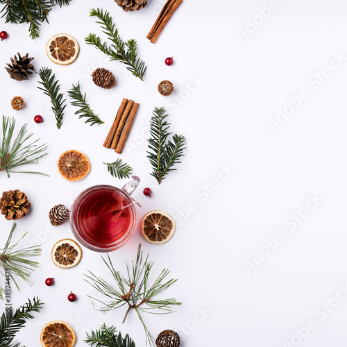 Creative Christmas layout made with fir, apples, branches and pine cone on bright light background. Minimal winter or New Year seasonal concept. Flat lay, border frame.