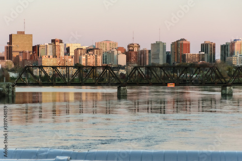 ottawa city skyline at dusk with prince of wales bridge over the ottawa river