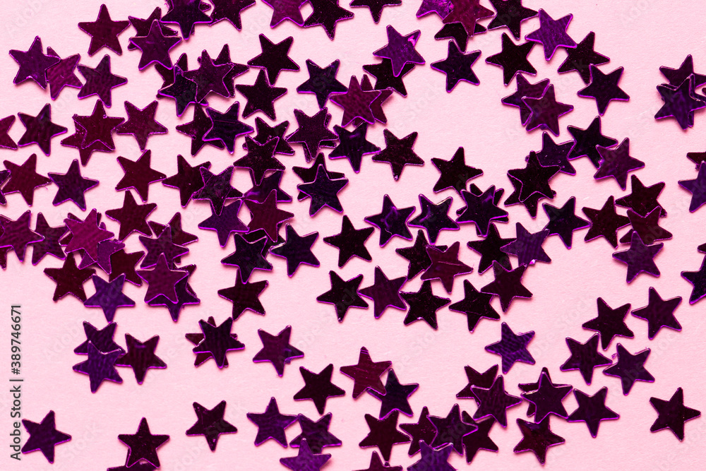 Closeup asterisks sprinkled on a pink isolated background. View from above. Closeup asterisks sprinkled on a pink isolated background. View from above.
