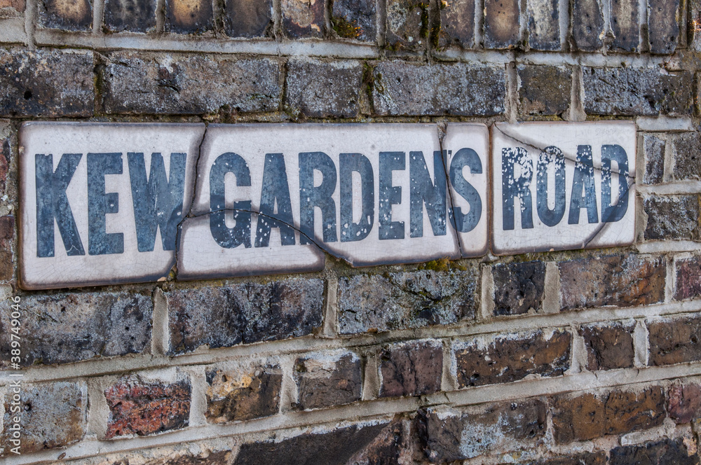 Fototapeta premium Kew Gardens Road sign on a brick wall.