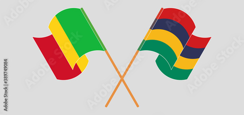 Crossed and waving flags of Mali and Mauritius