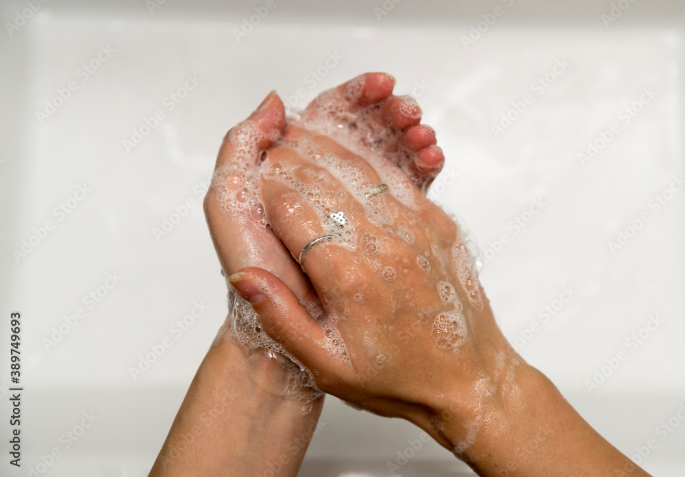wash hands with soap. water. 
foam female hands