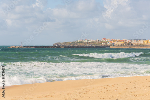 Supertubos beach surfing paradise in Peniche with Lighthouse, in Portugal © Luis