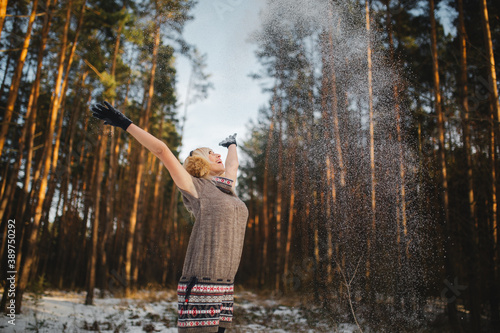 portrait of a beautiful girl in a snowy forest.woman in winter park