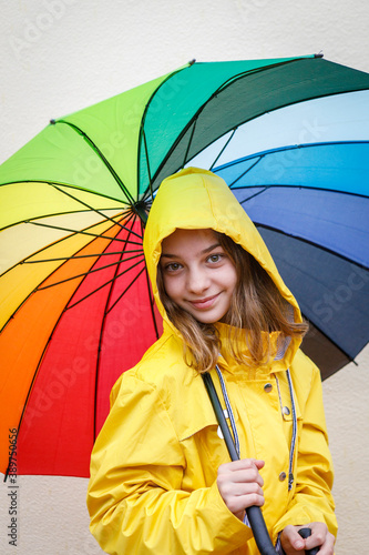 beautiful teenager girl wearing yellow raincoat
