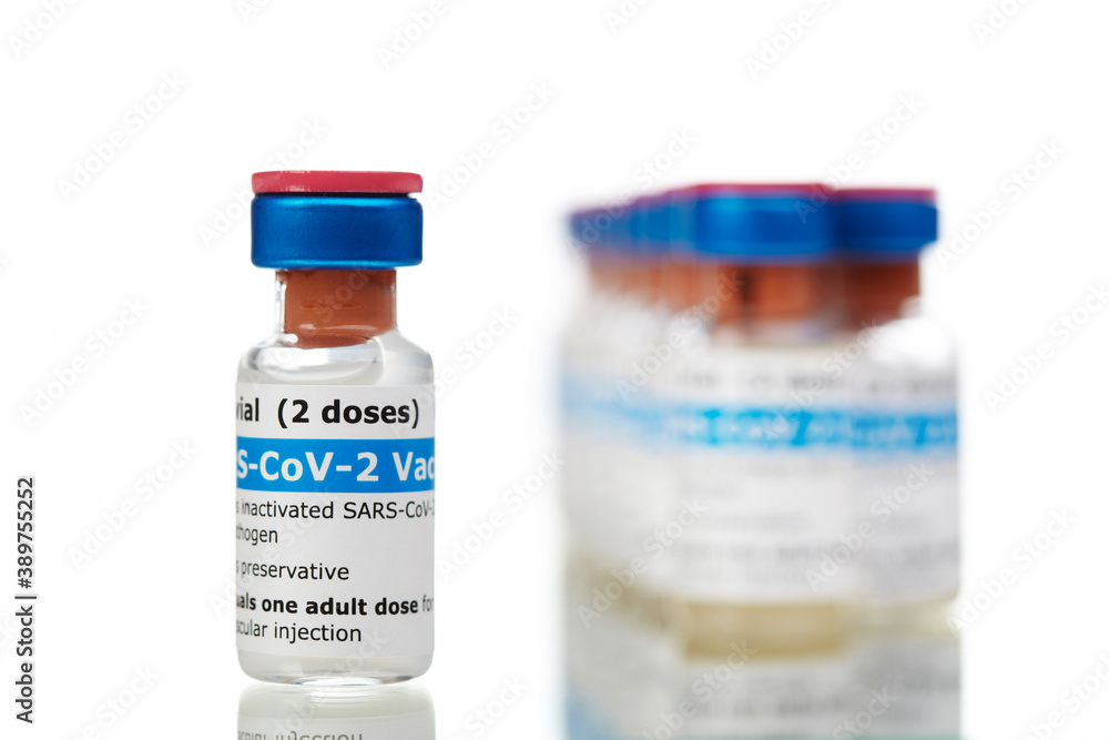 Bottles of new SARS-CoV-2 vaccine on table ready for application Bottles of new SARS-CoV-2 vaccine on table ready for application