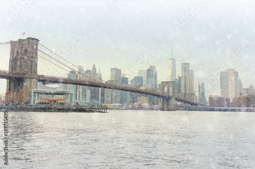 Stunning views of a famous suspended Brooklyn Bridge and Manhattan skyscrapers in New York from the riverside of the East River at a winter sunset. Sightseeing of NYC.