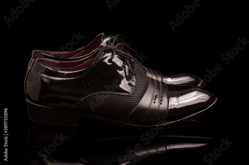 Pair of black stylish male shoes isolated