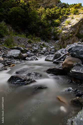 Mountain stream in the Switzerland. net blue water in Swiss Alps