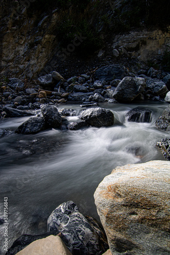 Mountain stream in the Switzerland. net blue water in Swiss Alps