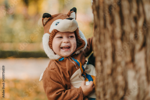 Obraz na płótnie Cute baby boy dressed in fox costume in autumn park