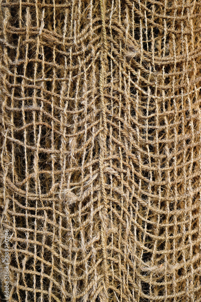 weave of thick and rough ropes - texture of a rustic net weave of thick and rough ropes - texture of a rustic net