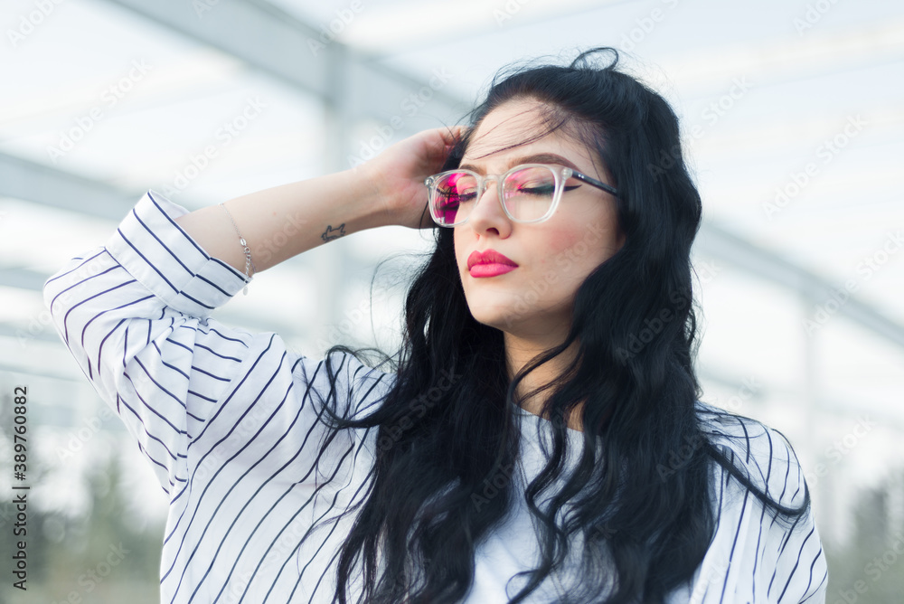 Beautiful young businesswoman with glasses and shirt Beautiful young businesswoman with glasses and shirt