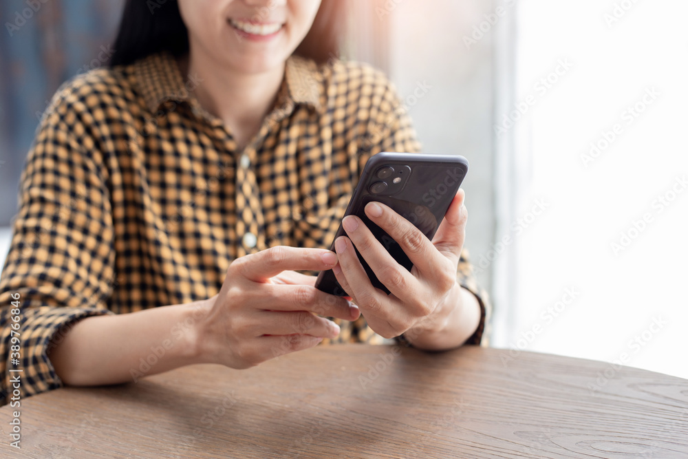 using cell phone.woman hand holding texting message mobile chatting,search internet information sitting in office.technology device contact communication connecting people