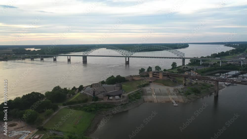Aerial View of Hernando de Soto Bridge Above Mississippi River Between Tennessee and Arkansas States, Memphis USA. Landmark on Summer Sunset Sunlight, Drone Shot Aerial View of Hernando de Soto Bridge Above Mississippi River Between Tennessee and Arkansas States, Memphis USA. Landmark on Summer Sunset Sunlight, Drone Shot