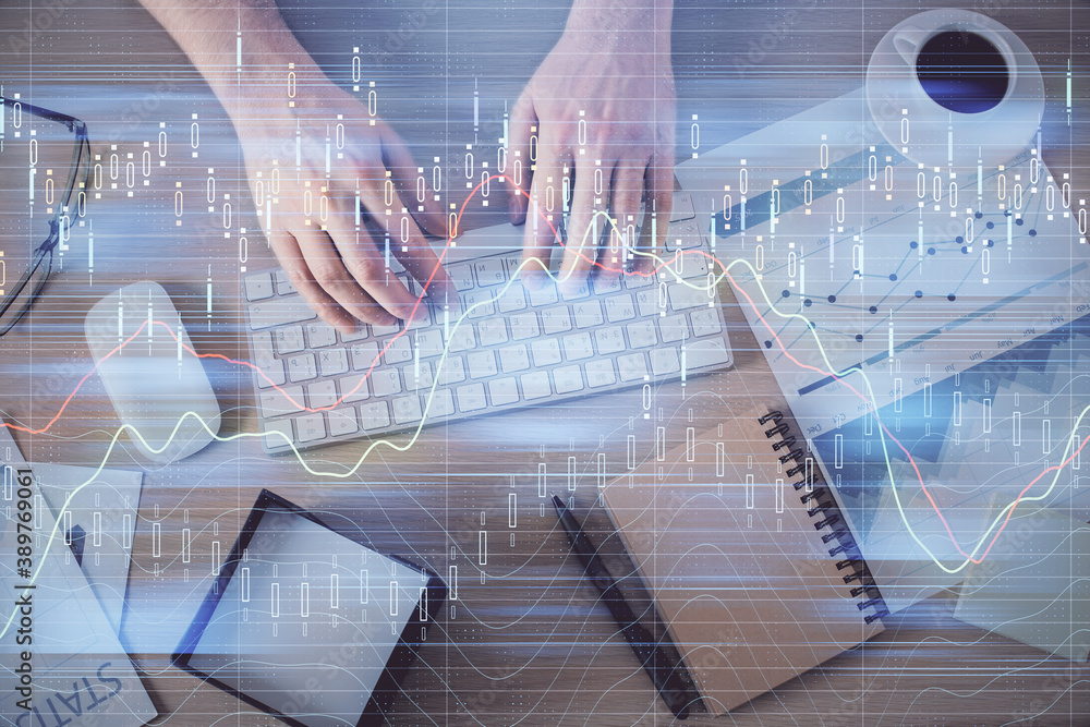 Multi exposure of man's hands typing over computer keyboard and forex graph hologram drawing. Top view. Financial markets concept. Multi exposure of man's hands typing over computer keyboard and forex graph hologram drawing. Top view. Financial markets concept.