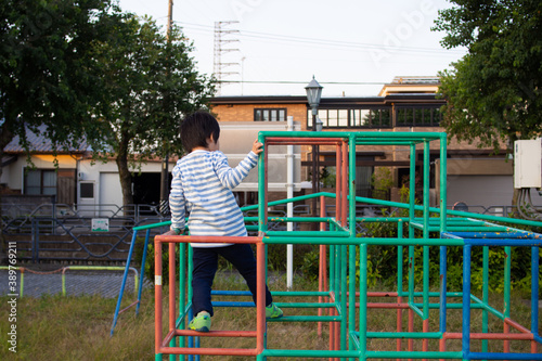 Fotografie Japanese kindergarten children playing in a jungle gym in a park in Gifu City, G