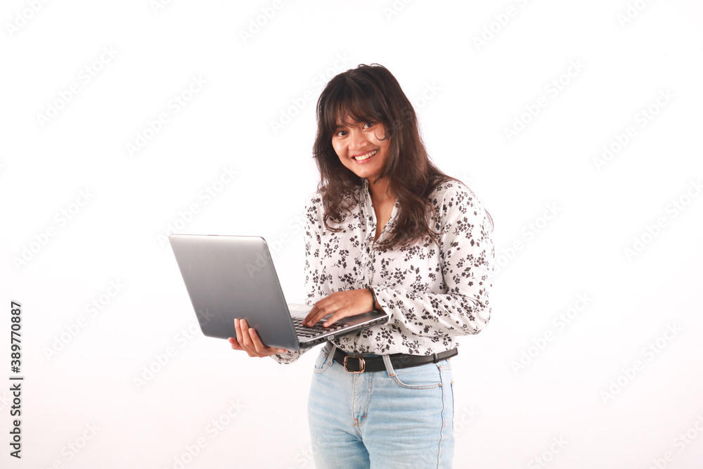 Portrait of an excited young beautiful girl holding laptop computer and celebrating success isolated over white background. Portrait of an excited young beautiful girl holding laptop computer and celebrating success isolated over white background.