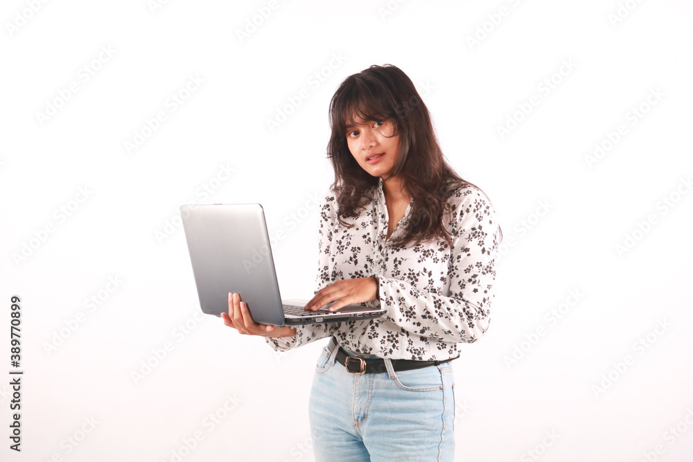 Portrait of an excited young beautiful girl holding laptop computer and celebrating success isolated over white background Portrait of an excited young beautiful girl holding laptop computer and celebrating success isolated over white background