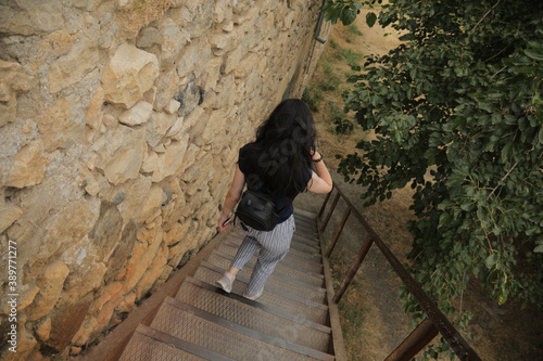 High angle shot of a female walking down the stairs in a park in Karabagh photo
