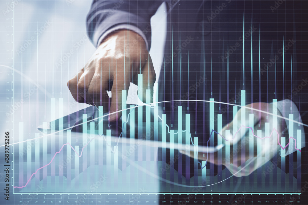 Double exposure of man's hands holding and using a digital device and forex graph drawing. Financial market concept. Double exposure of man's hands holding and using a digital device and forex graph drawing. Financial market concept.