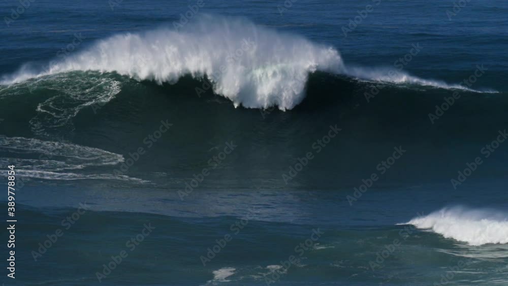 Slow motion of a outside wave in Nazaré, Portugal. Nazaré is a small village in Portugal with the biggest waves in the world. Slow motion of a outside wave in Nazaré, Portugal. Nazaré is a small village in Portugal with the biggest waves in the world.
