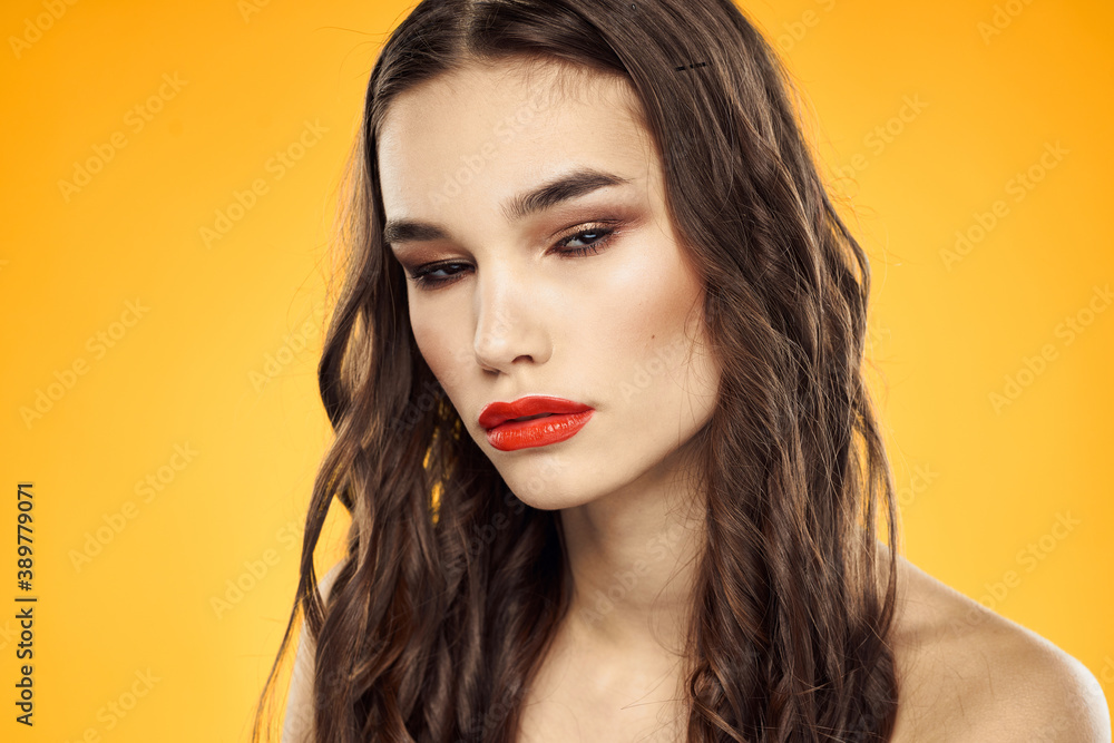 Woman with bare shoulders red cropped lips charm yellow background