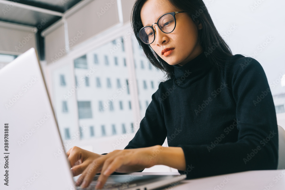Image of asian woman working from home Image of asian woman working from home