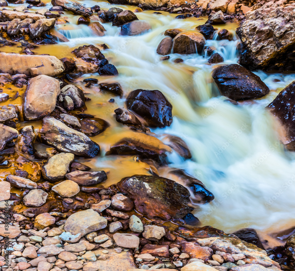 Polluted Mine Waste Drains Into Red Mountain Creek Turning The Water Orange, Uncompahgre National Forest, Colorado, USA