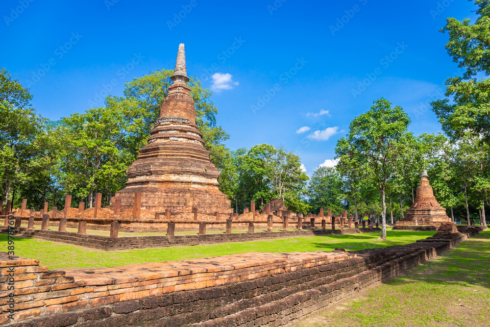 Landmark of old chedi made of ancient bricks in the Kamphaeng Phet Historical Park, Thailand.