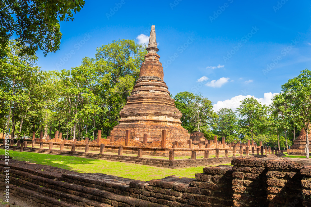 Landmark of old chedi made of ancient bricks in the Kamphaeng Phet Historical Park, Thailand.