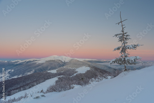 Snowy winter in the Ukrainian Carpathian mountains with traveling tourists © reme80